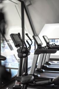a row of treadmills in a gym at Courtyard by Marriott Puerto Montt in Puerto Montt +63 photos