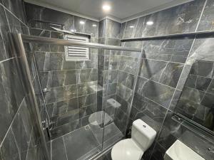 a bathroom with a toilet and a glass shower at Akapella in Pamukkale +68 photos