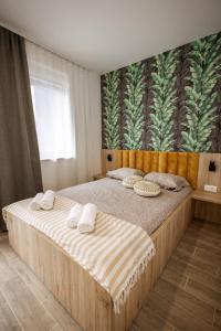 Postel nebo postele na pokoji v ubytování Cozy Studio Apartment in Osijek - self check in