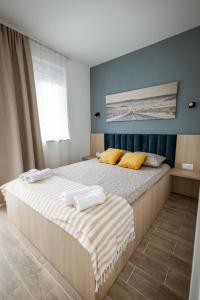 Postel nebo postele na pokoji v ubytování Cozy Studio Apartment in Osijek - self check in