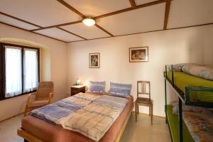 a bedroom with a bed in a room at Casa Merlot - Happy Rentals in Caslano