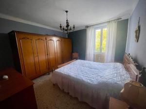 Ένα ή περισσότερα κρεβάτια σε δωμάτιο στο Casa della nonna +18 φωτογραφίες