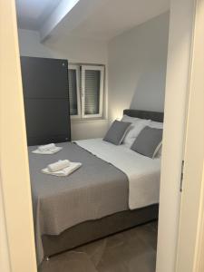 Postel nebo postele na pokoji v ubytování Apartman TINI 2