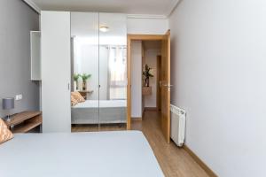 A bed or beds in a room at BaruHaus Nido Valencia de don Juan