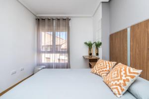 A bed or beds in a room at BaruHaus Nido Valencia de don Juan