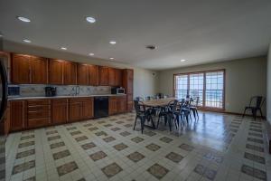 a large kitchen with a table and chairs at OCHG Lankford Oceanfront Penthouse in Ocean City
