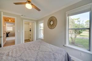 a bedroom with a bed and a window at Apopka Home with Yard and Grill Near Wekiwa Springs! in Apopka