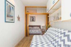 a bedroom with a bed in a room at Lux apartment Draga with balkony in Split