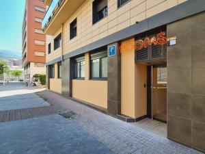 a building with a sign on the side of it at Bilbao ROOMS Miribilla in Bilbao