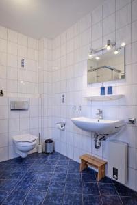 Koupelna v ubytování Ferienwohnung Ankerplatz Dornumersiel