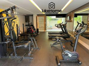 a gym with several tread machines in a room at Eco Summer Tambaú, LikeHome in Tambaú