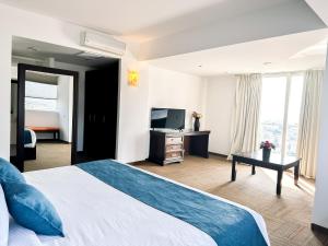 a hotel room with a bed and a television at Hotel Stadium in Le&oacute;n