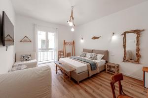 Ένα ή περισσότερα κρεβάτια σε δωμάτιο στο Global Central Suites