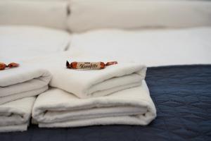 A bed or beds in a room at La Bella - Entire Apartment near Gozsdu udvar
