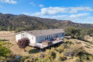 a house in the middle of a field at Five Points House with Amazing Views in Tehachapi