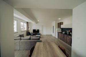 a living room with a couch and a table at Eyebee apartments in Ohrid