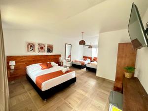 Cama ou camas em um quarto em Eco-Hotel Palma É Coco