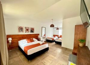 Cama ou camas em um quarto em Eco-Hotel Palma É Coco