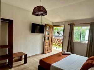 Cama ou camas em um quarto em Eco-Hotel Palma É Coco