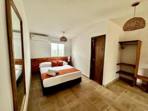 Cama ou camas em um quarto em Eco-Hotel Palma É Coco