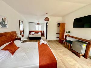 Cama ou camas em um quarto em Eco-Hotel Palma É Coco