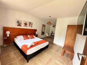 Cama ou camas em um quarto em Eco-Hotel Palma É Coco