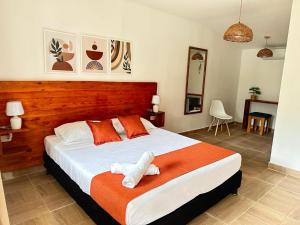Cama ou camas em um quarto em Eco-Hotel Palma É Coco