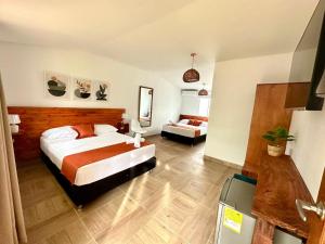 Cama ou camas em um quarto em Eco-Hotel Palma É Coco