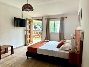 Cama ou camas em um quarto em Eco-Hotel Palma É Coco