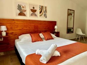 Cama ou camas em um quarto em Eco-Hotel Palma É Coco