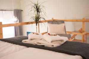 A bed or beds in a room at La Bella - Entire Apartment near Gozsdu udvar