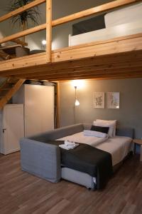A bed or beds in a room at La Bella - Entire Apartment near Gozsdu udvar