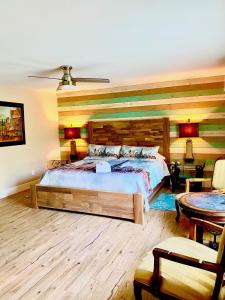 a bedroom with a large bed and a table at Oak Cottages 6 in Rockport