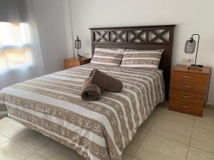 Postel nebo postele na pokoji v ubytování Arcoiris Paradise A 300 metros de la playa ,piscina y parque infantil