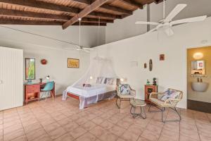 Postel nebo postele na pokoji v ubytování Villa San Sebastian Curaçao