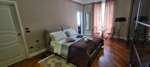 a bedroom with a bed with pillows on it at Le Sale Resort in Caserta