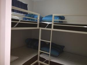 a bunk bed with two bunk beds in a room at Jervis Bay Holiday Cabins in Sussex Inlet