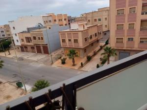 an overhead view of a city street with buildings at Appartement familial Nador Selouane in Selouane
