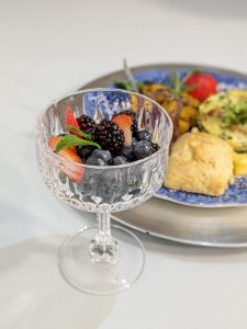 a glass bowl filled with fruit on a plate at Uhuburg Castle in Helen +53 photos