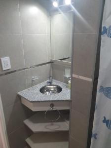 a bathroom with a sink and a mirror at Heart Depto 1 Viedma Centro Confortable y Optima Ubicación in Viedma +9 photos