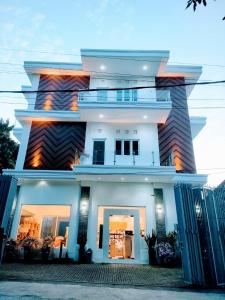 a white house with the front of it at Villa Emas Mulia Uluwatu Standard 5 in Uluwatu