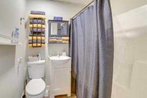 a bathroom with a toilet and a sink at Morgantown Home 1 Mi to West Virginia University! in Morgantown +18 photos