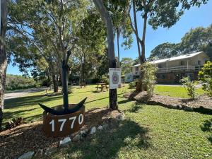 a park with a sign that says on it at 1770 Holiday Village in Seventeen Seventy