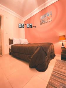 a bedroom with a large bed in a room at Layback apartment in 6 October city Cairo in 6th Of October