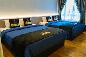 Postel nebo postele na pokoji v ubytování Hotel Lavie at Centrum