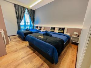 Postel nebo postele na pokoji v ubytování Hotel Lavie at Centrum