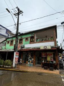 a building on the side of a city street at Pousada Vida Mansa in Porto De Galinhas