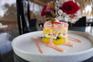 a piece of cake on a plate on a table at Hotel Gran Marquez in Moquegua