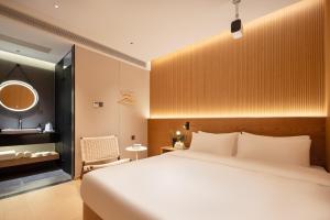 Shanghai Captain 5 Youth Hotel - Xinzhuang Metro Station 객실 침대
