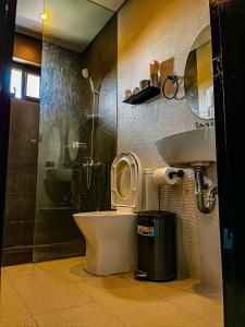 a bathroom with a toilet and a sink at The Pacific Coast in Boracay +75 photos